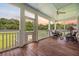 Relaxing screened back porch with ceiling fan and views of the private backyard at 727 Sonny Boy Ln, Johns Island, SC 29455