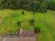 Expansive backyard features lush green lawn, mature trees, and a fenced area, perfect for outdoor activities at 727 Sonny Boy Ln, Johns Island, SC 29455