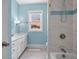Bright bathroom features a large vanity, tiled shower, and a window at 727 Sonny Boy Ln, Johns Island, SC 29455