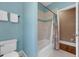 Bright bathroom with a tile and curtained shower, adjacent to the toilet at 727 Sonny Boy Ln, Johns Island, SC 29455