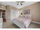 Cozy bedroom with a white bed frame, floral bedding, and a double door closet at 727 Sonny Boy Ln, Johns Island, SC 29455