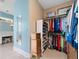 Walk-in closet with custom shelving and storage solutions, next to a vanity at 727 Sonny Boy Ln, Johns Island, SC 29455