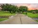 Driveway with trees lining the way to this spacious single-Gathering home at 727 Sonny Boy Ln, Johns Island, SC 29455