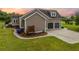 Home exterior with attached garage, featuring a spacious driveway and well-maintained landscaping at 727 Sonny Boy Ln, Johns Island, SC 29455