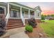 Charming porch with stairs, lush greenery, and exterior lighting at 727 Sonny Boy Ln, Johns Island, SC 29455