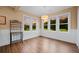 Inviting sunroom with natural light, wood floors, and views of the backyard at 727 Sonny Boy Ln, Johns Island, SC 29455