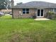 Spacious backyard features a well-maintained lawn, patio, and fenced in area at 7713 Suzanne Dr, North Charleston, SC 29418