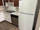 The kitchen features white cabinets, stainless steel appliances, and marble-look countertops at 7713 Suzanne Dr, North Charleston, SC 29418