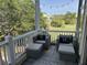 Charming balcony view complete with outdoor chairs and a beautiful outdoor vista at 81 Sandbar Ln # 28, Folly Beach, SC 29439