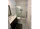 Bathroom featuring a glass-enclosed shower, toilet, modern vanity, and stylish gray tile floor at 81 Sandbar Ln # 28, Folly Beach, SC 29439