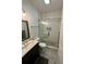 Bathroom featuring a glass-enclosed shower, toilet, modern vanity, and stylish gray tile floor at 81 Sandbar Ln # 28, Folly Beach, SC 29439