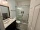 Bathroom featuring a glass-enclosed shower, toilet, modern vanity, and stylish gray tile floor at 81 Sandbar Ln # 28, Folly Beach, SC 29439