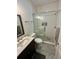 Bathroom featuring a glass-enclosed shower, toilet, modern vanity, and stylish gray tile floor at 81 Sandbar Ln # 28, Folly Beach, SC 29439