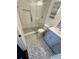 Bathroom featuring a glass-enclosed shower, toilet, modern vanity, and stylish gray tile floor at 81 Sandbar Ln # 28, Folly Beach, SC 29439