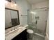 Modern bathroom with glass-enclosed shower, subway tile, and elegant vanity at 81 Sandbar Ln # 28, Folly Beach, SC 29439