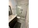 Modern bathroom featuring a glass shower, vanity, and subway tile at 81 Sandbar Ln # 28, Folly Beach, SC 29439