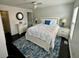 Cozy bedroom with white furniture, ceiling fan, and blue accent rug at 81 Sandbar Ln # 28, Folly Beach, SC 29439