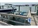 Dock with boat slip featuring lift for convenient storage and waterway access at 81 Sandbar Ln # 28, Folly Beach, SC 29439