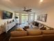 Inviting living room featuring a comfortable sectional sofa, media center, and access to outdoor balcony at 81 Sandbar Ln # 28, Folly Beach, SC 29439
