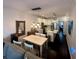 Open concept living area with kitchen and dining area; modern pendant lighting accents the space at 81 Sandbar Ln # 28, Folly Beach, SC 29439