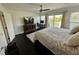 Well-lit main bedroom boasting a desk, entertainment center, and balcony access at 81 Sandbar Ln # 28, Folly Beach, SC 29439