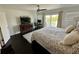 Comfortable main bedroom with balcony access, entertainment center, and natural light at 81 Sandbar Ln # 28, Folly Beach, SC 29439