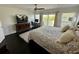 Well-lit main bedroom boasting a desk, entertainment center, and balcony access at 81 Sandbar Ln # 28, Folly Beach, SC 29439