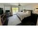 Bright main bedroom featuring a workspace, balcony, and neutral color scheme at 81 Sandbar Ln # 28, Folly Beach, SC 29439