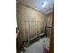 Interior of storage room with fishing rods mounted to the wall at 81 Sandbar Ln # 28, Folly Beach, SC 29439