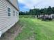 A view of the side and backyard with shed. and tall grass at 838 Ranch Hill Ln, Saint Stephen, SC 29479