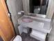 The bathroom has a pink sink, toilet, and medicine cabinet at 838 Ranch Hill Ln, Saint Stephen, SC 29479