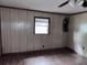 The living room has wood floor, wood paneling, and a ceiling fan at 838 Ranch Hill Ln, Saint Stephen, SC 29479