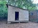 Exterior view of wooden shed and brick home at 838 Ranch Hill Ln, Saint Stephen, SC 29479
