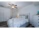 Bedroom showcasing a ceiling fan, closet, and wrought iron style bed with a soft color palette at 855 Club Cottage Rd, Edisto Island, SC 29438