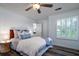 Comfortable bedroom featuring a ceiling fan, and a bedside table, creating a relaxing space at 855 Club Cottage Rd, Edisto Island, SC 29438