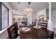 Dining area with table for six, next to kitchen with stainless steel appliances at 855 Club Cottage Rd, Edisto Island, SC 29438