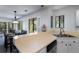 Kitchen with breakfast bar overlooking dining area, showcasing an open concept at 855 Club Cottage Rd, Edisto Island, SC 29438
