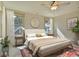 Bright main bedroom with natural light, a neutral color palette, and elegant furnishings at 8621 Connor Ct, North Charleston, SC 29406