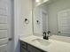 Elegant bathroom with bright lighting features a white countertop vanity with black hardware and modern faucet at 8629 Connor Ct, North Charleston, SC 29406