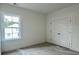 Well-lit bedroom showcases a window with exterior view and a double door closet at 8629 Connor Ct, North Charleston, SC 29406
