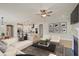 Bright living area with hardwood floors and a fireplace seamlessly connects to the open-concept kitchen and dining space at 8629 Connor Ct, North Charleston, SC 29406