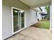 Covered patio area showcases a sliding glass door leading to a well-maintained yard at 8629 Connor Ct, North Charleston, SC 29406