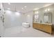 Bright bathroom with a large shower, soaking tub, decorative lights, and a wood vanity with double sinks at 974 Cliffwood Dr, Mount Pleasant, SC 29464