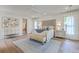 Spacious bedroom with hardwood floors, a large bed, matching dressers, and area rug at 974 Cliffwood Dr, Mount Pleasant, SC 29464