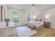 Bright and airy bedroom with hardwood floors, neutral paint, stylish decor, and many windows at 974 Cliffwood Dr, Mount Pleasant, SC 29464