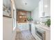 Charming butler's pantry boasts sleek counters, a wine fridge, and ample storage at 974 Cliffwood Dr, Mount Pleasant, SC 29464