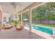 Covered patio overlooking a pool, lounge chairs, and backyard with privacy fence at 974 Cliffwood Dr, Mount Pleasant, SC 29464