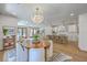 The dining and kitchen areas feature stylish décor and furnishings, creating a bright and welcoming open-concept living space at 974 Cliffwood Dr, Mount Pleasant, SC 29464