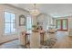 The dining area features a round wooden table with upholstered chairs and stylish decor, creating a cozy space at 974 Cliffwood Dr, Mount Pleasant, SC 29464