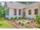 The house has well-manicured landscaping, featuring a variety of plants and flowers, complementing the home's exterior design at 974 Cliffwood Dr, Mount Pleasant, SC 29464